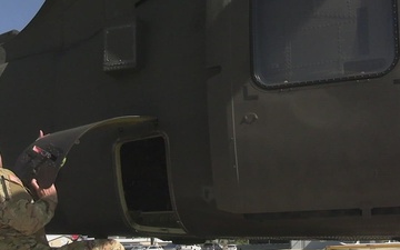 U.S. Army soldiers with JTF-SB conduct helicopter pre-flight check