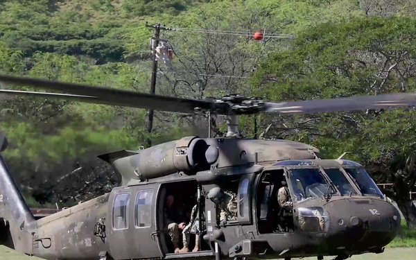 Emergency management leaders discuss Hawaii National Guard support and flight observations of flood impacted areas on Oahu