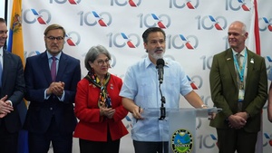 Ribbon cutting ceremony celebrating the first commercial flight from the United States to Venezuela in seven years