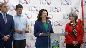 Ribbon cutting ceremony celebrating the first commercial flight from the United States to Venezuela in seven years