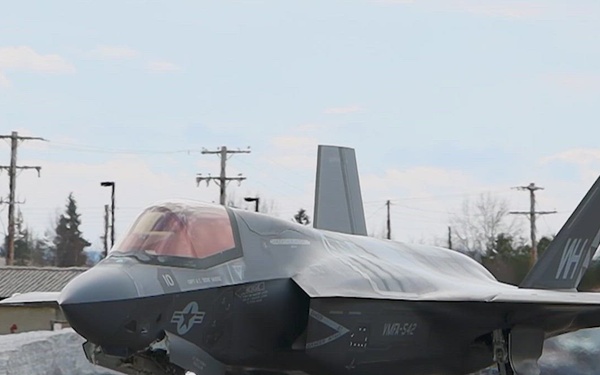 U.S. service members unload ordnance from aircraft participating in exercise Red Flag-Alaska