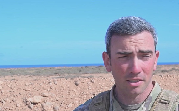 US Army 1st Sgt. Cole Dahmer discusses 173rd Airborne Brigade gunnery skills during African Lion 26