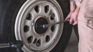 U.S. Marines conduct tire maintenance on F-35C