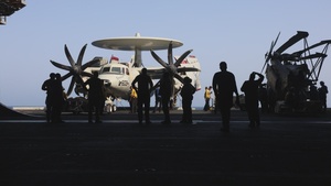Sailors tow aircraft aboard USS George H.W. Bush
