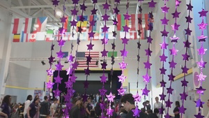 Blooming Anywhere: SHAPE Teacher Highlights the Strength of Military Youth during MOMC B-roll Purple up assembly