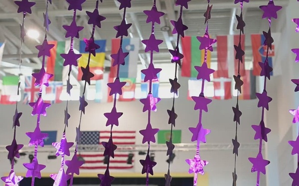 Blooming Anywhere: SHAPE Teacher Highlights the Strength of Military Youth during MOMC B-roll Purple up assembly