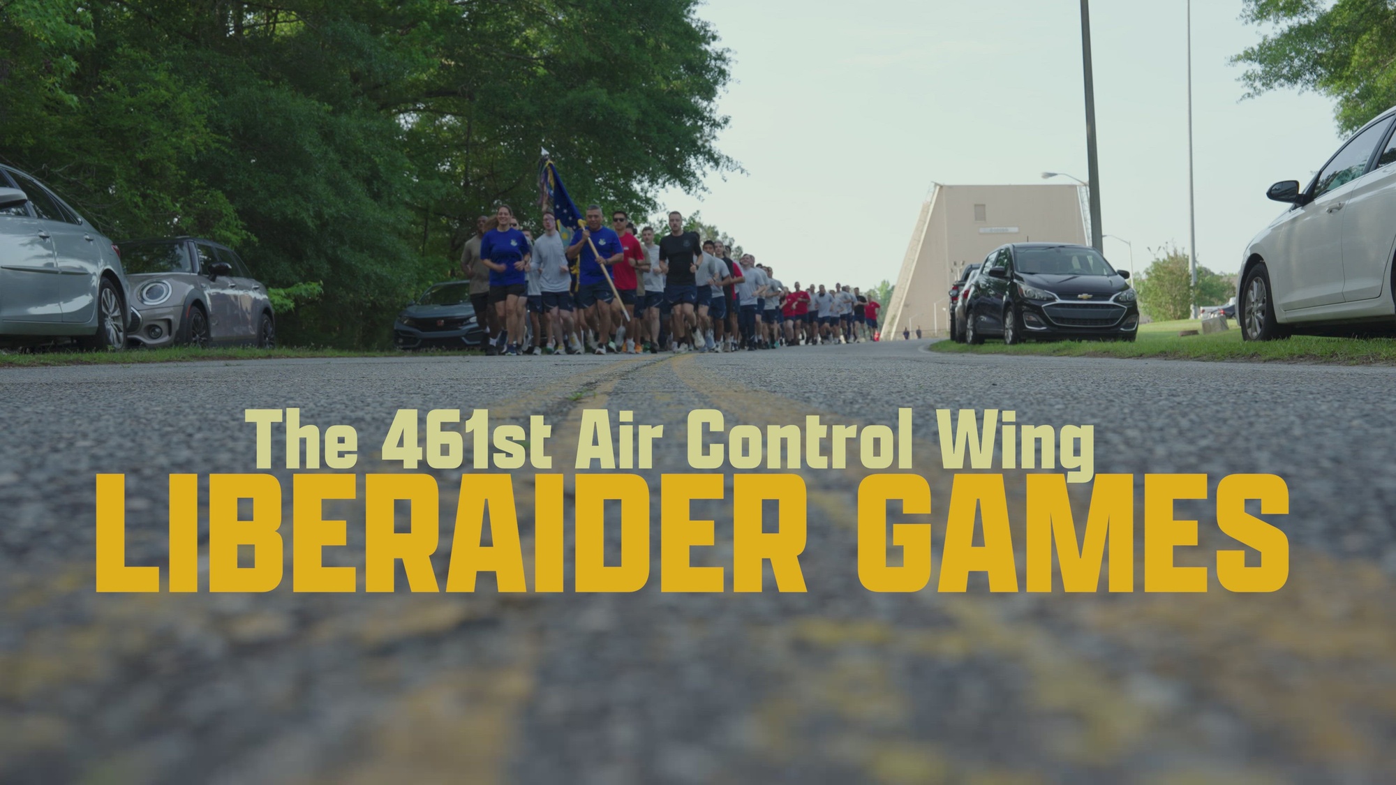 Miitary personnel run a 5K, play flag football, pickleball and kickball.