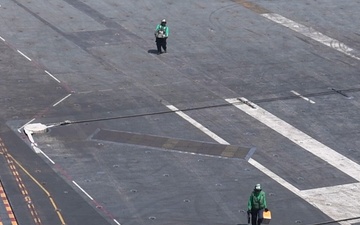 Sailors Conduct Maintenance and Transport Equipment