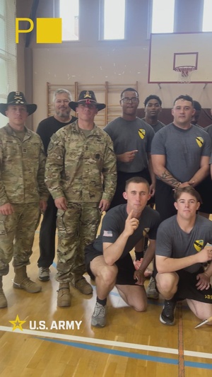 8th Brigade Engineer Battalion Soldiers participate in a volleyball match at a Polish high school