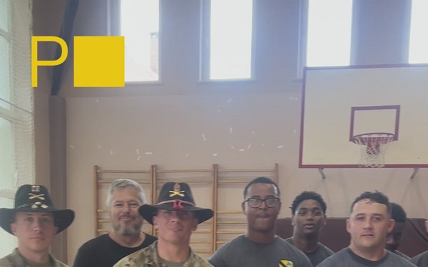 8th Brigade Engineer Battalion Soldiers participate in a volleyball match at a Polish high school