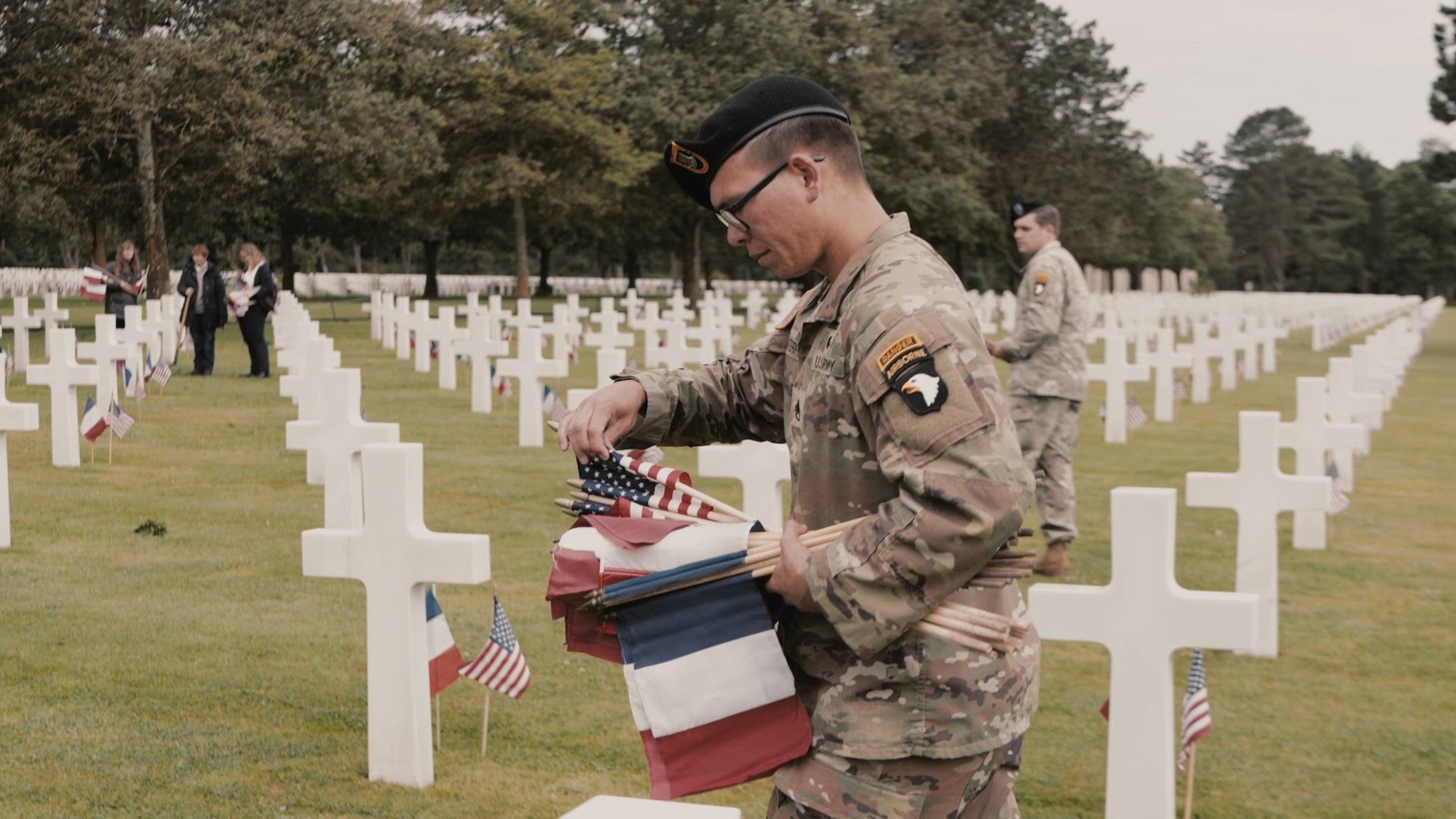 Soldiers assigned to the 101st Airborne Division (Air Assault) and 173rd Airborne Brigade, U.S. Military Academy cadets, and members of the American Battle Monuments Commission place 18,778 flags at the Normandy American Cemetery in Colleville-sur-Mer, France, June 5, 2026, during events commemorating the 82nd anniversary of D-Day. The flags included 9,389 U.S. flags and 9,389 French flags, honoring the service members buried at the cemetery and the enduring bond between the United States and France.

(U.S. Army video by Capt. Jennifer French)