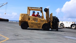U.S. Sailors transport ordnance
