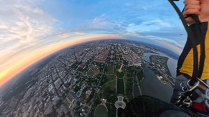 The U.S. Army Parachute Team flies by Washington Monument for sunset jump