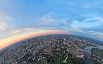 The U.S. Army Parachute Team flies by Washington Monument for sunset jump