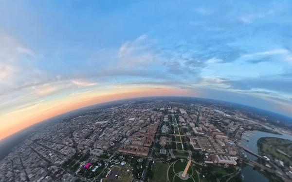 The U.S. Army Parachute Team flies by Washington Monument for sunset jump