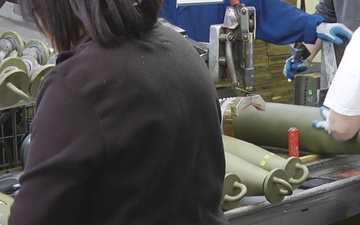 Inspection process following capping for 155mm/M795 projectile round production at Iowa Army Ammunition Plant.