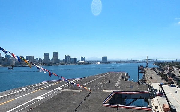 USS Carl Vinson team hoists display car onto the flight deck for NASCAR San Diego Weekend