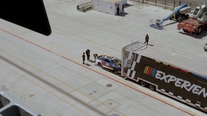 USS Carl Vinson team hoists display car onto the flight deck for NASCAR San Diego Weekend