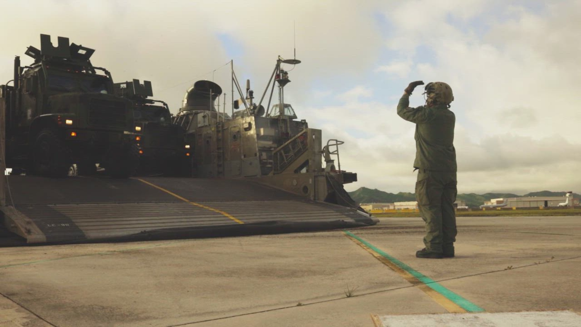 U.S. Marines assigned to 15th Marine Expeditionary Unit, I Marine Expeditionary Force, load personnel and equipment onto landing craft, air cushion attached to Assault Craft Unit 5, during an in-stream offload at Marine Corps Base Hawaii, June 8, 2026. The in-stream offload transported personnel and equipment from Wasp-class amphibious assault ship USS Essex (LHD 2) to shore as part of the 15th MEU disembarkation for Exercise Rim of the Pacific (RIMPAC) 2026. Thirty nations, more than 30 surface ships, 5 submarines, 15 national land forces, more than 206 aircraft and 30,000 personnel are participating in RIMPAC in and around the Hawaiian Islands, June 24 to July 31. The world's largest international maritime exercise, RIMPAC provides a unique training opportunity while fostering and sustaining cooperative relationships among participants critical to ensuring the safety of sea lanes and security on the world's oceans. RIMPAC 2026 is the 30th exercise in the series that began in 1971. (U.S Marine Corps video by Staff Sgt. Ezekieljay Correa)