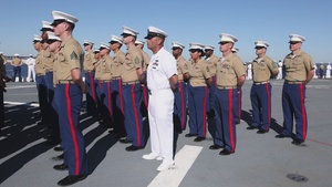U.S. Marines and Sailors man the rails aboard the USS Arlington (LPD-24)