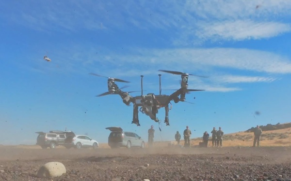 Oregon engineers breach a wire obstacle with a drone-delivered Bangalore torpedo