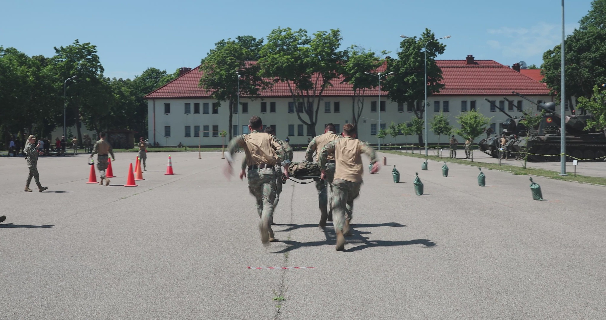 U.S. Army Soldiers, with the 2nd Battalion, 3rd Field Artillery Regiment, Croatian soldiers, with the 17th Croatian contingent, Croatian Armed Force, and Romanian soldiers from the 348th Air Defense Artillery Battalion, Romanian Land Forces, all of the NATO Forward Land Forces (FLF) Battle Group - Poland, participate in a military obstacle course in celebration of Romanian Flag Day at Bemowo Piskie Training Area, Poland, June 27, 2026. Teams of four finished the course within minutes or seconds of each other; events included tire and litter carries and pushing a Romanian URO Vehículo de Alta Movilidad Táctico, among others. The course reinforced the interoperability and readiness of the NATO FLF Battle Group along the alliance’s eastern flank. (U.S. Army Reserve video by Staff Sgt. Emilie Lenglain) Music is used with permission and licensing rights from Envato Elements.