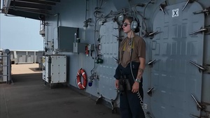 USS Tripoli Sailors Stand Lookout Watch
