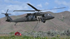 Idaho Army National Guard UH-60M Black Hawk helicopter crew conducts water bucket training.