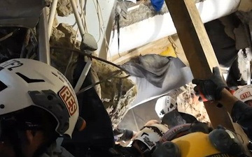 Man is rescued after almost four days trapped in collapsed building