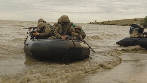 U.S. Marines and Romanian forces conduct combat rubber raiding craft operations in Romania