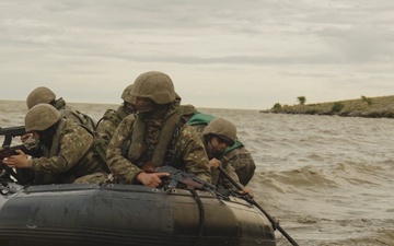 U.S. Marines and Romanian forces conduct combat rubber raiding craft operations in Romania