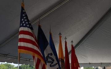 Flags lined up in preparation for the groundbreaking ceremony for the new Future Artillery Complex at Iowa Army Ammunition Plant.