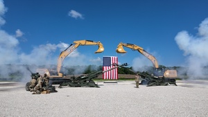 Canons fire in celebration of the groundbreaking for the new Future Artillery Complex (FAC) at Iowa Army Ammunition Plant.