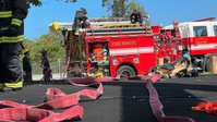 Firefighters conduct rescue training at Torii Station
