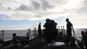 USS John Paul Jones (DDG 53) sets sea and anchor detail while arriving at Naval Base Guam