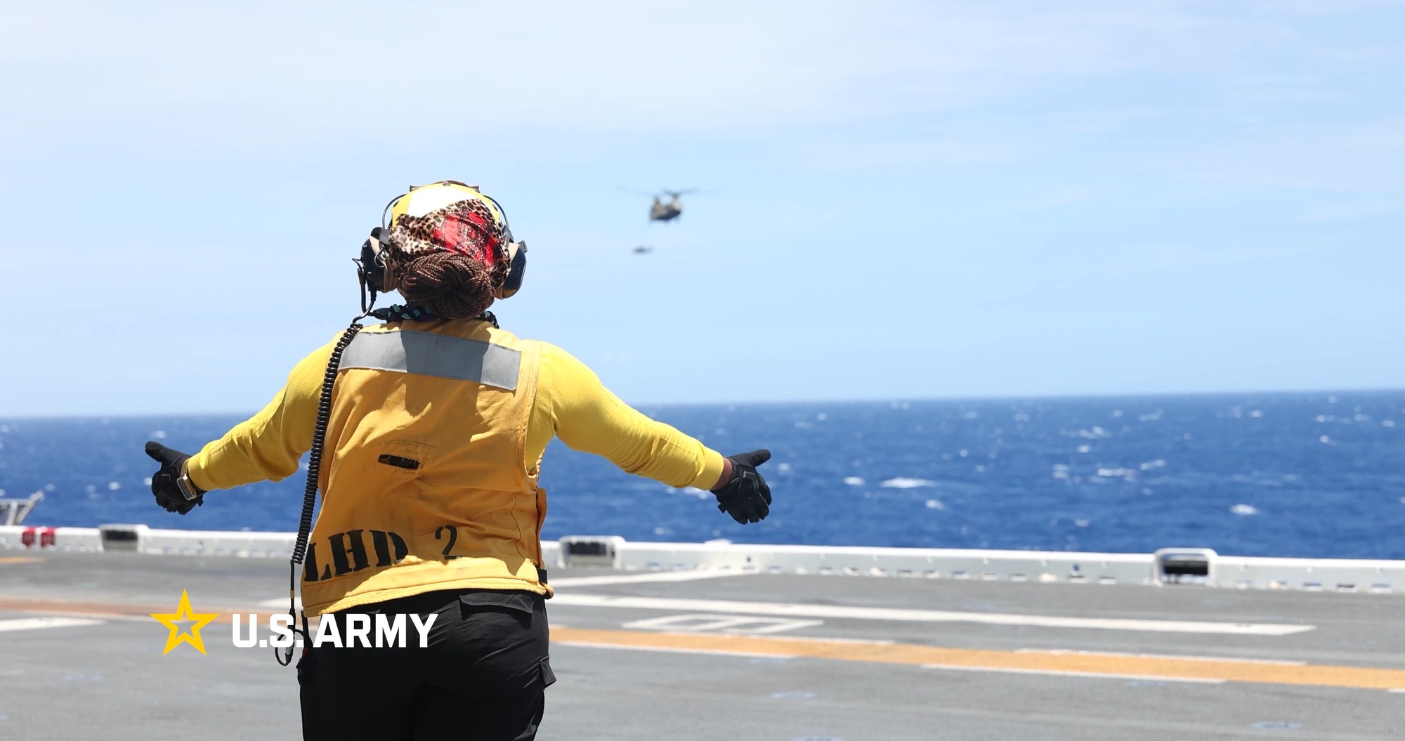 Two service members discuss Rimpac 2026.