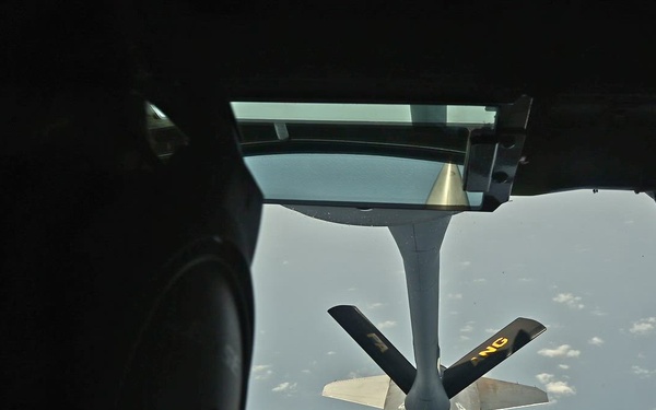 KC-135 refuels F-16 for theater stability