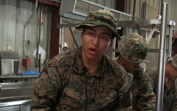 U.S. Marine with 2nd Bn., 1st Marines, speaks on food service specialists