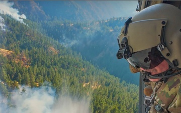 Oregon Guard HH-60 crew drops water on Hagen Fire