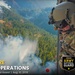 Oregon Guard HH-60 crew drops water on Hagen Fire