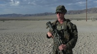 U.S. Marine with 2nd Bn., 1st Marines, speaks about squad-level operations during AFX