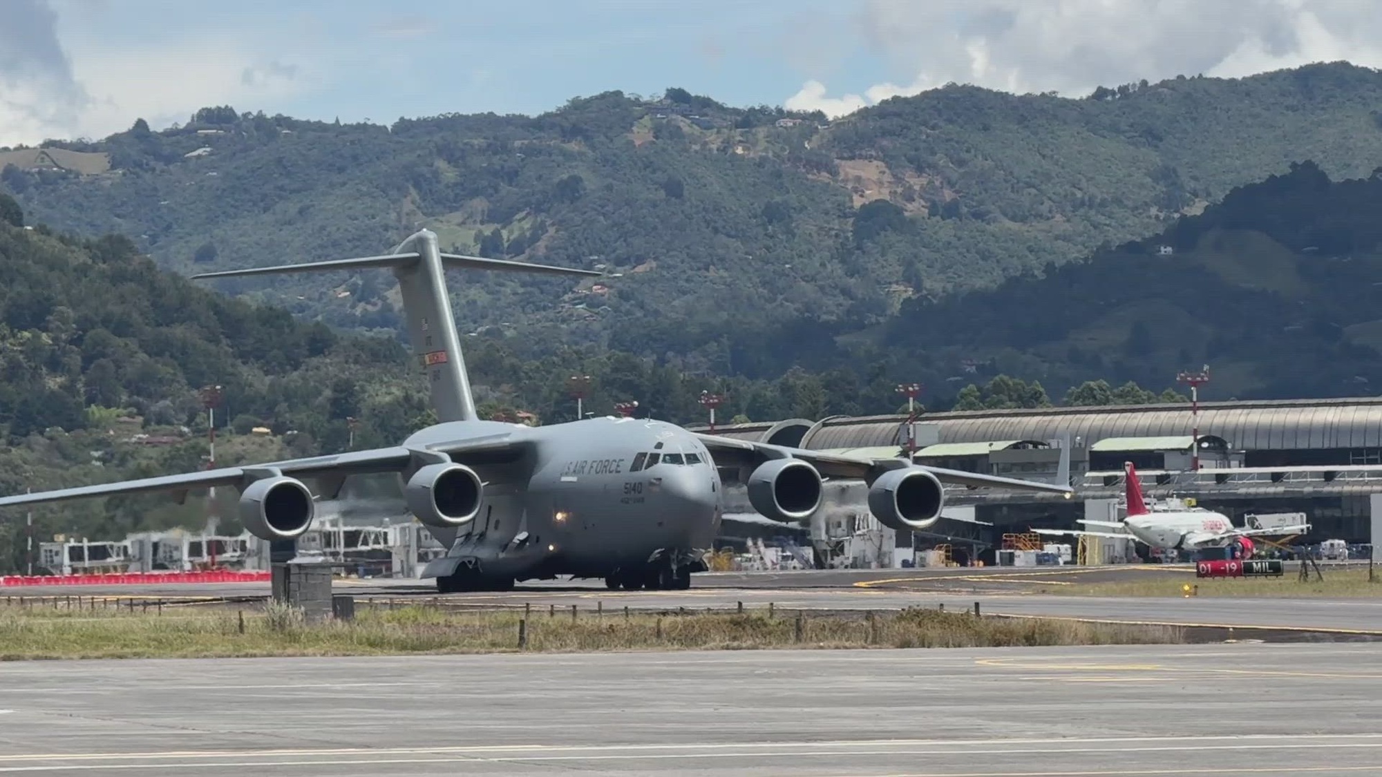 U.S. Air Force Airmen offload disaster assistance cargo from a C-17 Globemaster III in Medellín, Colombia.
