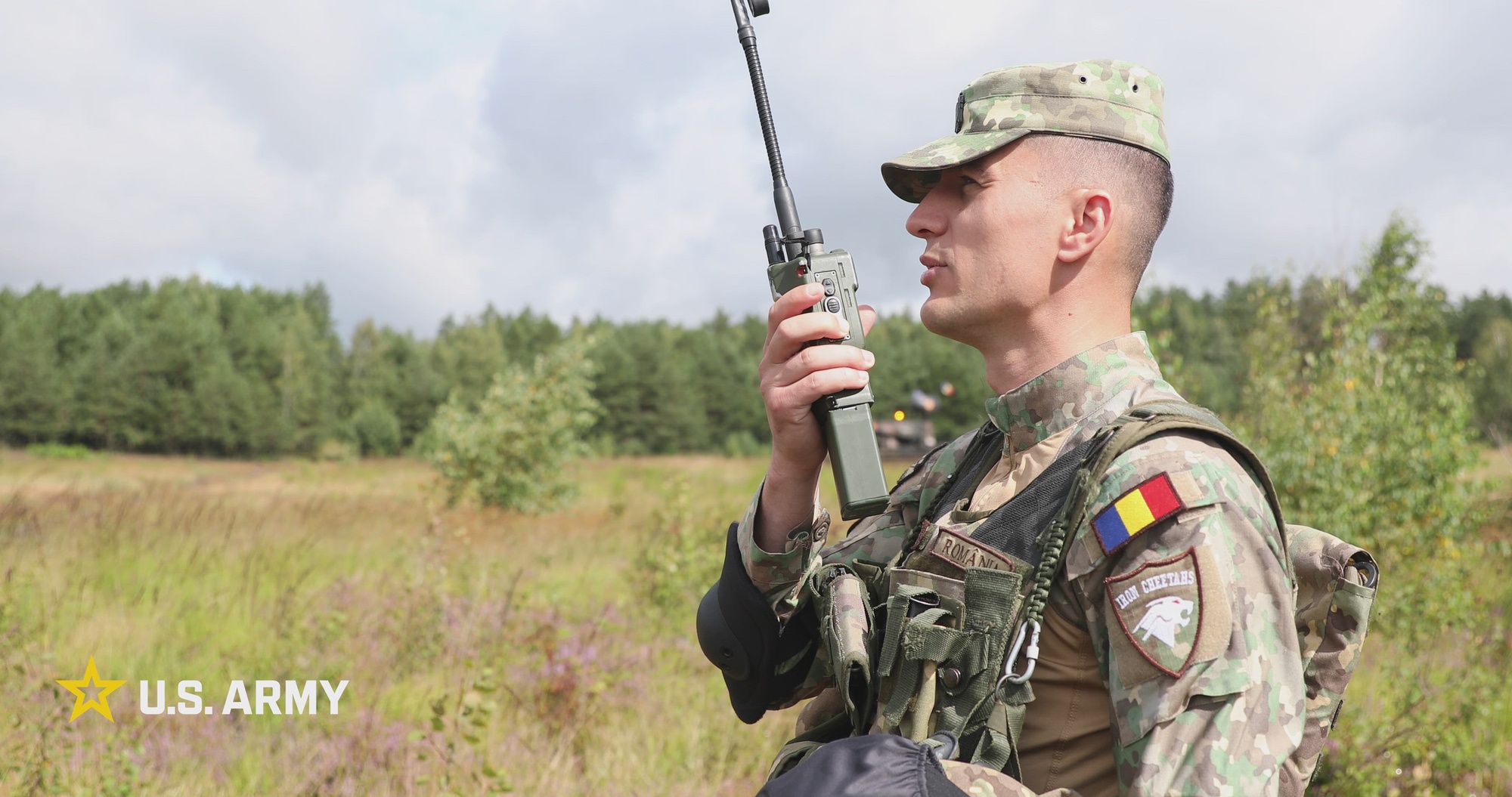 U.S. Army Lt. Thomas Keefe, strike section platoon leader, and U.S. Army Sgt. Nashoba Dickey, strike section team leader, assigned to Headquarters and Headquarters Company, 2nd Battalion, 37th Armored Regiment, coordinate unmanned aircraft system (UAS) flying with Romanian soldiers of the 348th Air Defense Artillery Battalion, NATO Forward Land Forces (FLF) Battle Group–Poland, during joint counter-UAS training at Bemowo Piskie Training Area in Poland on Aug. 18–19, 2026. The training area hosts NATO FLF Battle Group–Poland, one of V Corps’ ready forces in Europe. The battle group builds vigilance, lethality, and interoperability through collaborative forums, multinational exercises, unit-level training, and professional relationships with Allies. (U.S. Army Reserve photo by Staff Sgt. Emilie Lenglain) Music is used with permission and licensing rights from Envato Elements.