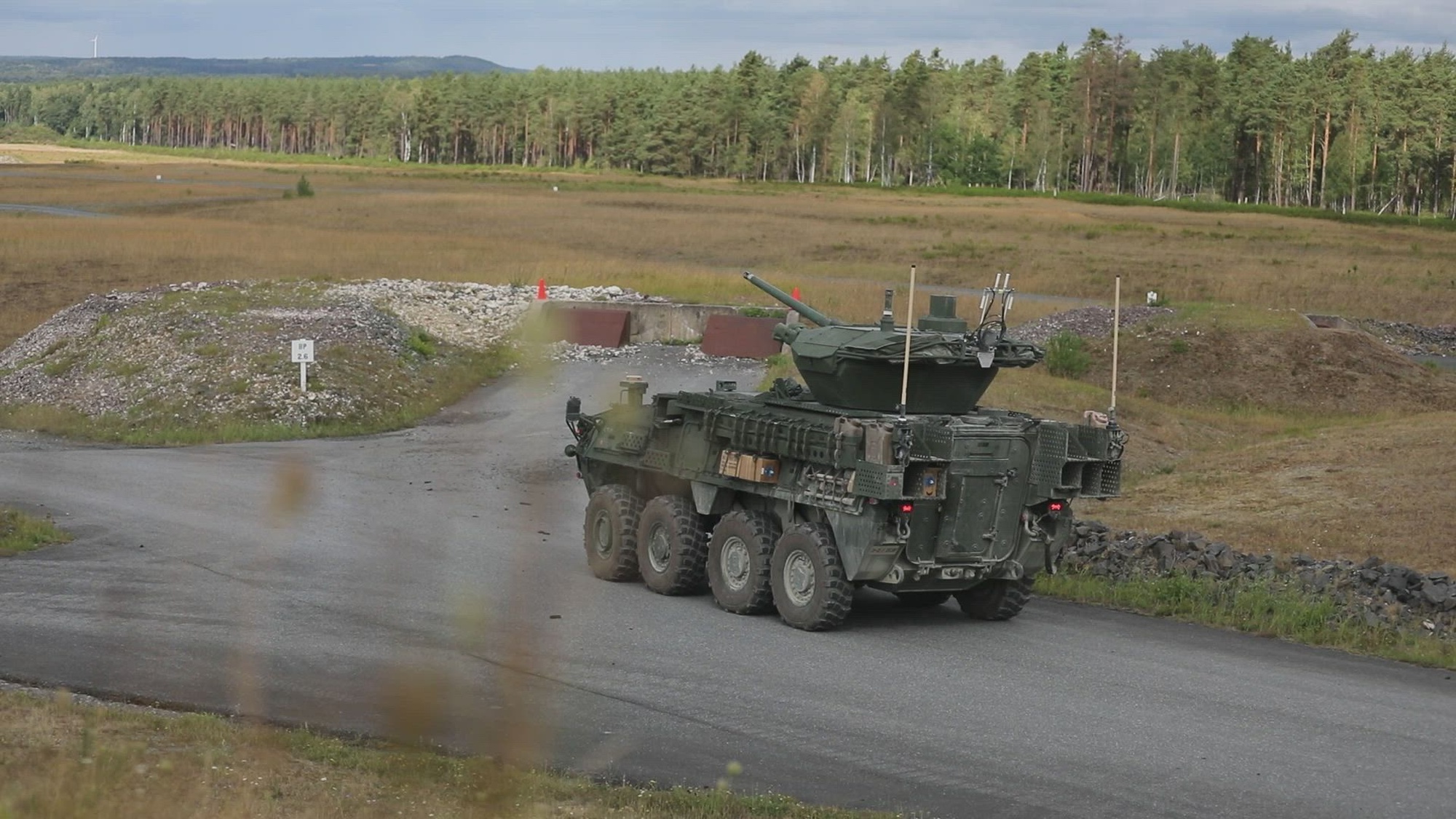 U.S. Army Staff Sgt. Jack Sargent, assigned to 3rd Squadron, 2d Cavalry Regiment, discusses the squadron’s familiarization gunnery and new platform at Grafenwoehr Training Area, Germany, Aug. 20, 2026. 3rd Squadron, 2d Cavalry Regiment, conducts Stryker Double V-Hull A1 (DVHA1) armored vehicle operator new equipment training, familiarization fire, and gunnery from Aug. 12-25, 2026, to qualify crews on their DVHA1 platforms. The training focuses on warfighting readiness and deterrence through live-fire training and collective exercises, building lethal, adaptable, combat-credible formations. (U.S. Army Reserve video by Staff Sgt. Vontrae Hampton)