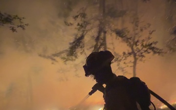 Firefighters Conduct Night Firing Operation on Timber Fire