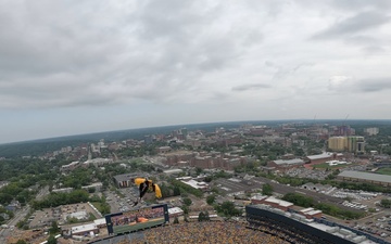 Michigan native on U.S. Army Parachute Team flies parachute to land at Michigan Stadium