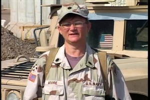 Cmdr. LESLIE MOORE