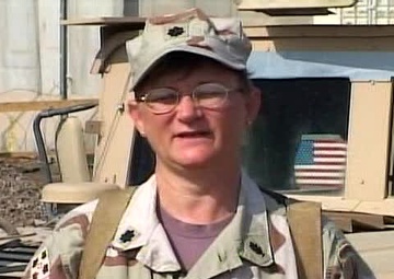 Cmdr. LESLIE MOORE