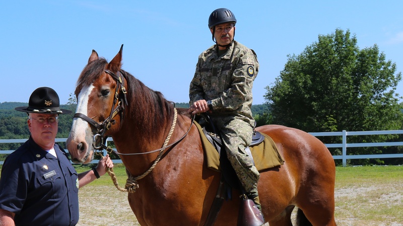 Major General Miguel Giordano, Uruguayan Defense Attaché to the US, saddles up on horse led by  Major James Marrinan, 2nd Company Governor&amp;#39;s Horse Guard in Newtown, Connecticut