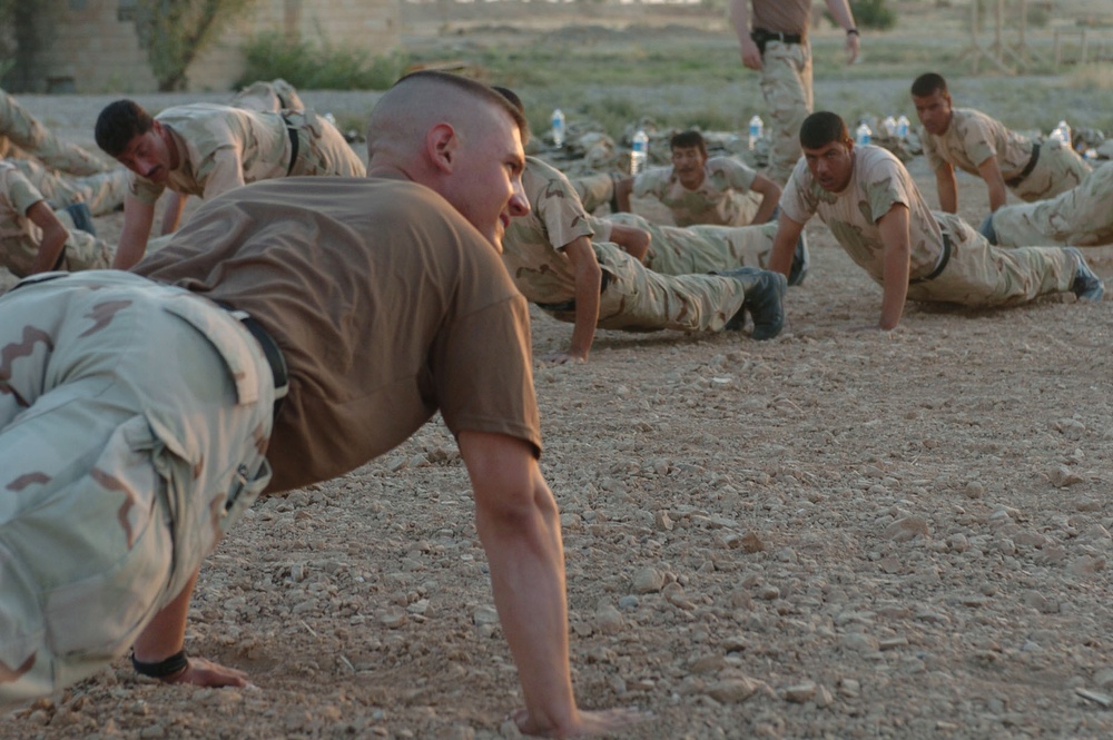 Iraqi National Guardsmen conduct physical training